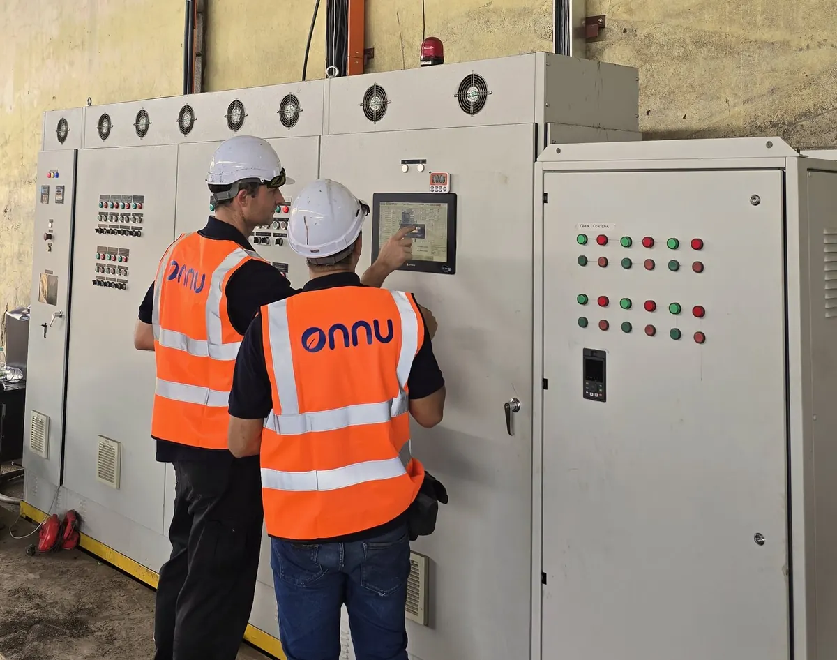 Two Onnu engineers in hi-vis at a pyrolysis plant control panel